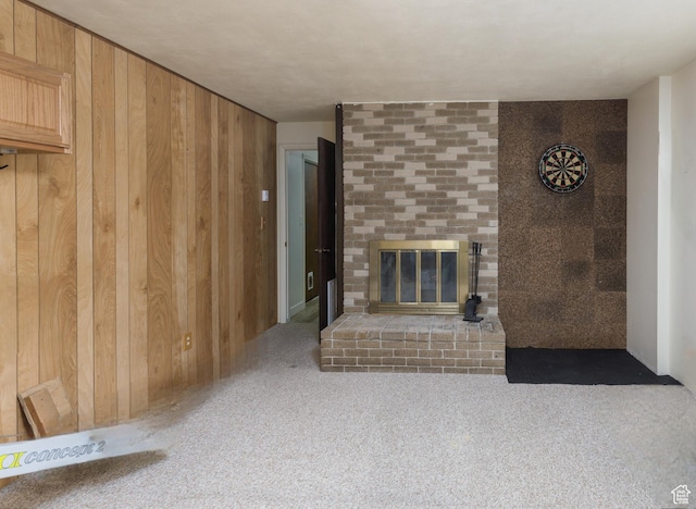 3250 N River Dr, Eden, UT 84310 - unfurnished living room with a fireplace, wood walls, and carpet flooring