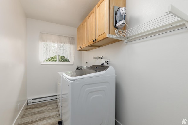 3250 N River Dr, Eden, UT 84310 - laundry room featuring baseboard heating, cabinet space, washing machine and dryer, and light wood-style floors