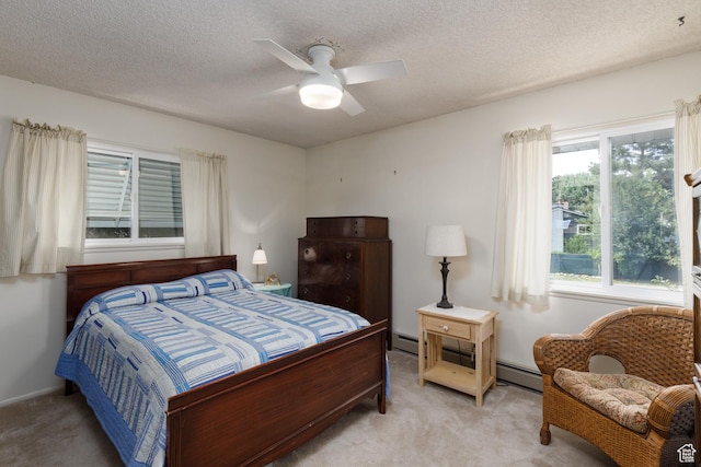 3250 N River Dr, Eden, UT 84310 - bedroom with light colored carpet, a textured ceiling, a baseboard radiator, and a ceiling fan