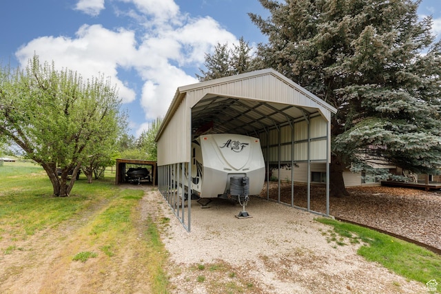 3250 N River Dr, Eden, UT 84310 - view of outbuilding featuring driveway and a carport
