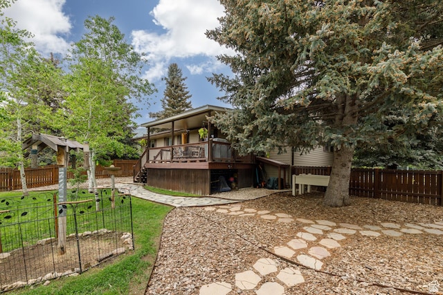 3250 N River Dr, Eden, UT 84310 - back of property featuring a deck and a fenced backyard