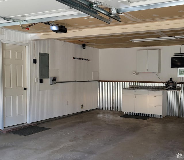 3250 N River Dr, Eden, UT 84310 - garage with electric panel and a garage door opener