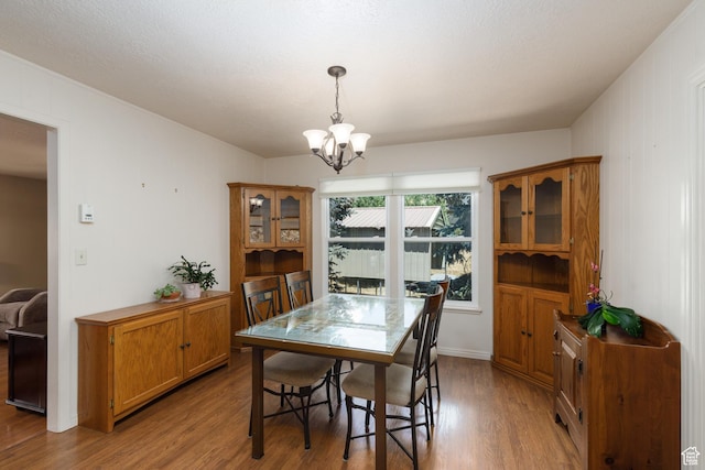 3250 N River Dr, Eden, UT 84310 - dining space featuring wood finished floors and a chandelier