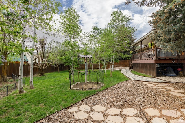 3250 N River Dr, Eden, UT 84310 - fenced backyard with a wooden deck and a garden