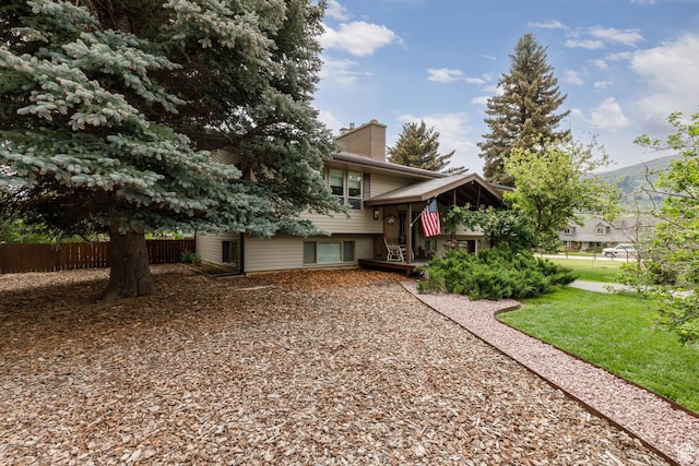 3250 N River Dr, Eden, UT 84310 - split level home featuring a chimney