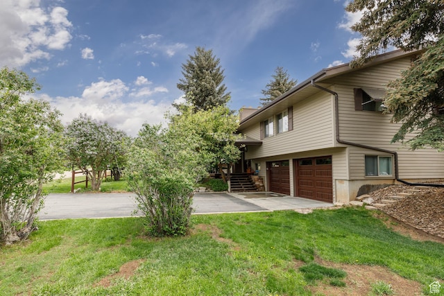 3250 N River Dr, Eden, UT 84310 - view of property exterior featuring an attached garage and a yard