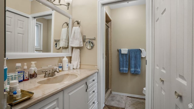 7488 S Blackfriar Cir, West Jordan, UT 84084 - bathroom with vanity, a stall shower, and a closet