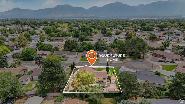 7488 S Blackfriar Cir, West Jordan, UT 84084 - aerial view of residential area with property boundaries highlighted and mountains