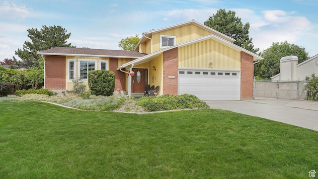 7488 S Blackfriar Cir, West Jordan, UT 84084 - view of front of home featuring brick siding, an attached garage, and concrete driveway