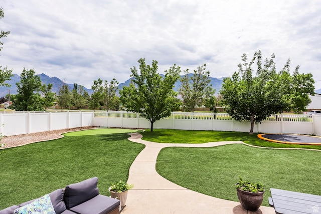 9768 N 5520 W, Highland, UT 84003 - fenced backyard with a mountain view and a patio area