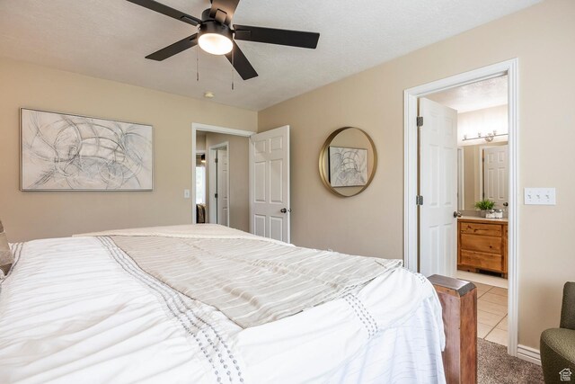 9768 N 5520 W, Highland, UT 84003 - carpeted bedroom with tile patterned floors, ensuite bath, and ceiling fan