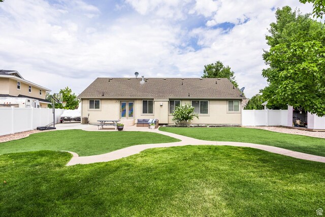 9768 N 5520 W, Highland, UT 84003 - back of house featuring a patio area, a fenced backyard, stucco siding, and a shingled roof