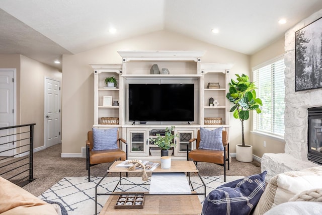 9768 N 5520 W, Highland, UT 84003 - living area featuring lofted ceiling, a stone fireplace, carpet floors, and recessed lighting