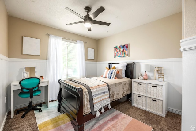 9768 N 5520 W, Highland, UT 84003 - carpeted bedroom with a wainscoted wall, ceiling fan, and a desk