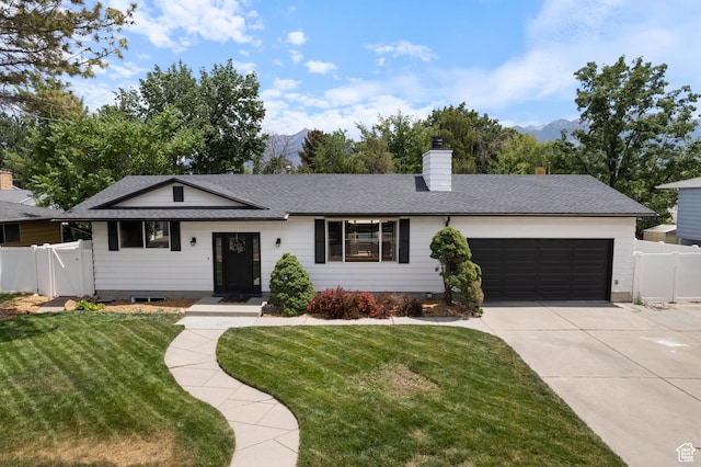 9499 S 220 E, Sandy, UT 84070 - single story home featuring an attached garage, concrete driveway, a mountain view, and a gate