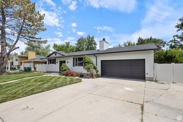 9499 S 220 E, Sandy, UT 84070 - ranch-style house featuring a garage, concrete driveway, and a chimney