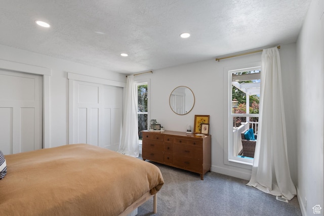 9499 S 220 E, Sandy, UT 84070 - bedroom with multiple windows, light carpet, recessed lighting, and a textured ceiling