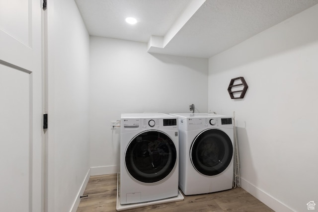 9499 S 220 E, Sandy, UT 84070 - laundry room featuring washing machine and clothes dryer and light wood-style floors