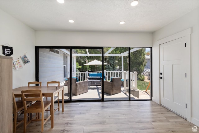 9499 S 220 E, Sandy, UT 84070 - dining space with light wood finished floors, recessed lighting, and a textured ceiling