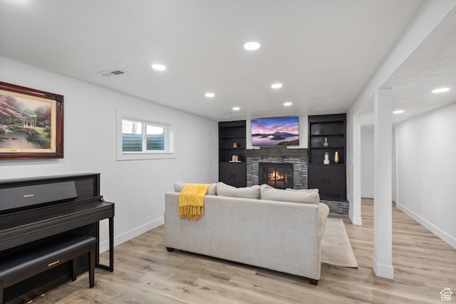 9499 S 220 E, Sandy, UT 84070 - living area with light wood-style flooring, recessed lighting, a fireplace, and built in shelves