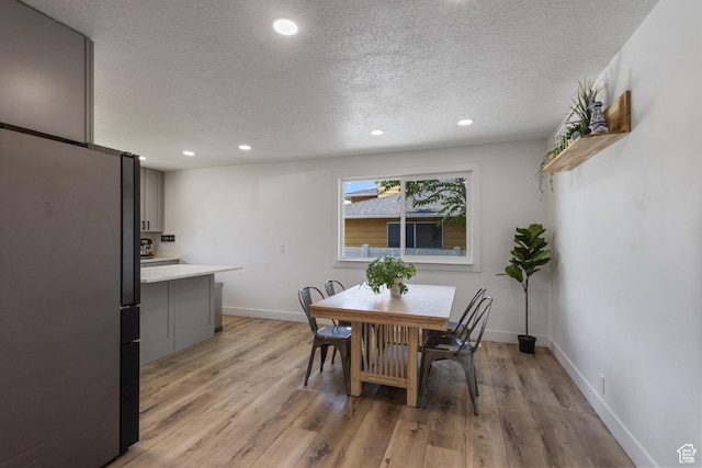 9499 S 220 E, Sandy, UT 84070 - dining area featuring a textured ceiling, recessed lighting, and light wood finished floors