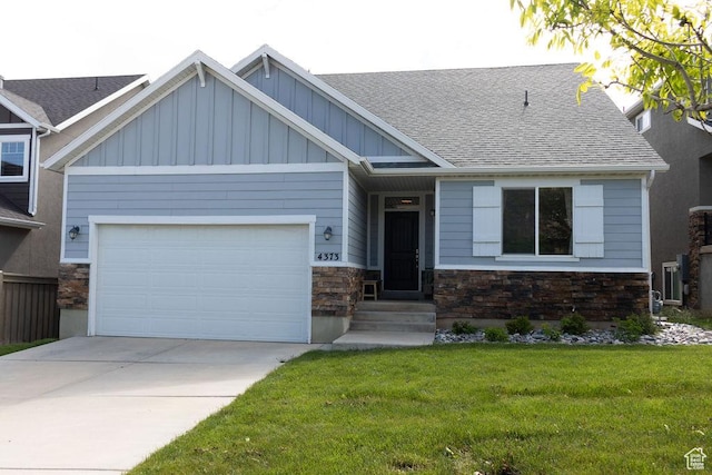 4373 N Foxtrail Dr, Lehi, UT 84043 - craftsman inspired home with stone siding, board and batten siding, a front lawn, and a garage