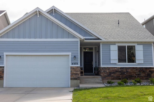 4373 N Foxtrail Dr, Lehi, UT 84043 - craftsman-style house with board and batten siding, driveway, a garage, and a shingled roof