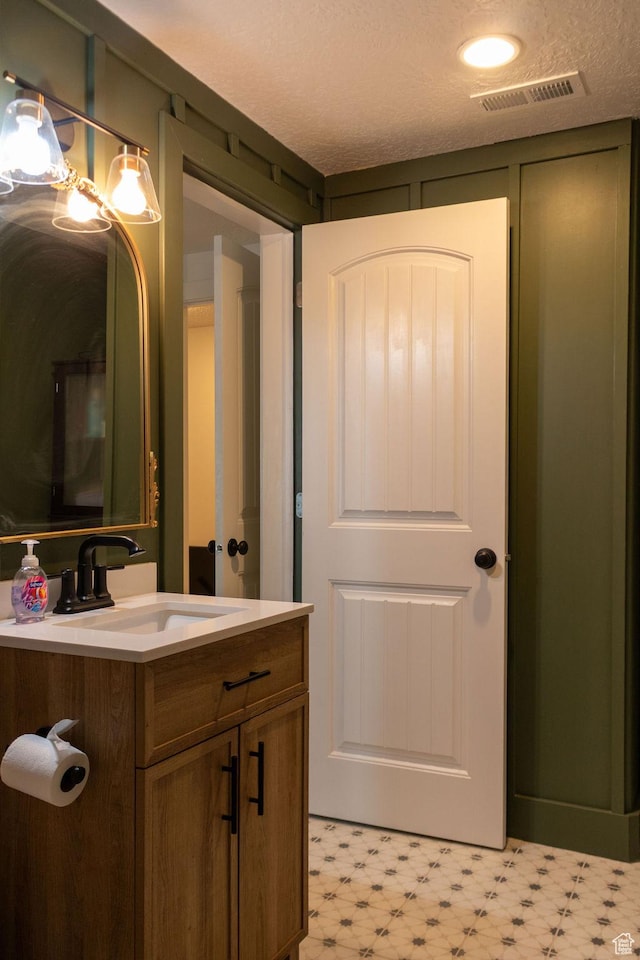 4373 N Foxtrail Dr, Lehi, UT 84043 - bathroom featuring vanity, tile patterned floors, and a textured ceiling