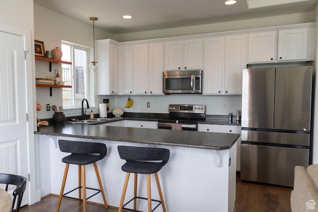 4373 N Foxtrail Dr, Lehi, UT 84043 - kitchen featuring stainless steel appliances, dark countertops, white cabinets, and recessed lighting