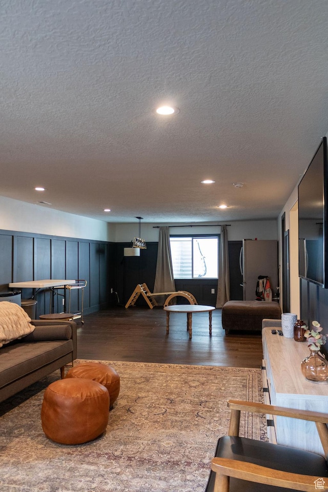 4373 N Foxtrail Dr, Lehi, UT 84043 - living area with a textured ceiling, dark wood-style flooring, and recessed lighting