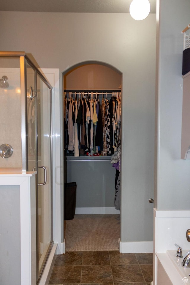 4373 N Foxtrail Dr, Lehi, UT 84043 - bathroom with a shower stall, a bath, and a spacious closet