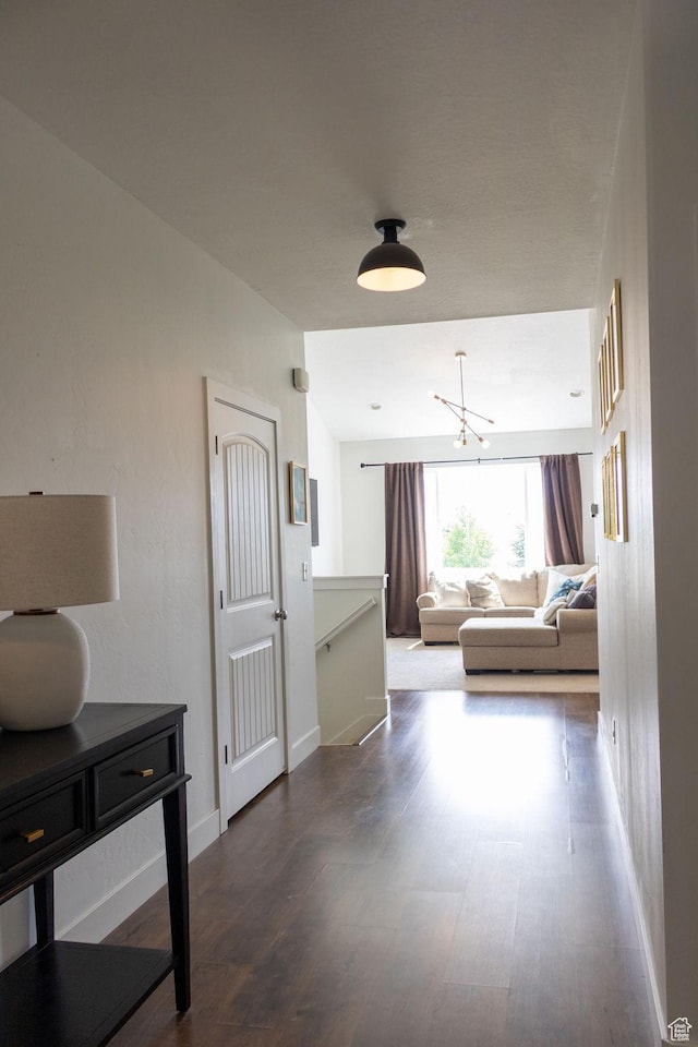 4373 N Foxtrail Dr, Lehi, UT 84043 - hallway featuring wood finished floors, a chandelier, and an upstairs landing