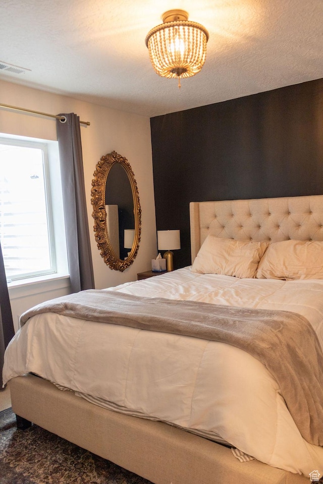 4373 N Foxtrail Dr, Lehi, UT 84043 - bedroom featuring a chandelier