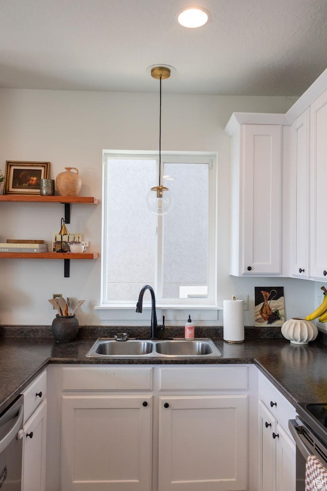 4373 N Foxtrail Dr, Lehi, UT 84043 - kitchen featuring white cabinets, dark countertops, and appliances with stainless steel finishes