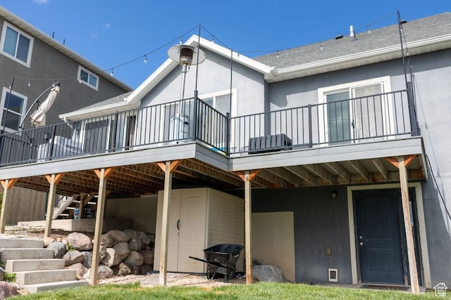 4373 N Foxtrail Dr, Lehi, UT 84043 - back of house featuring stucco siding, a deck, and roof with shingles
