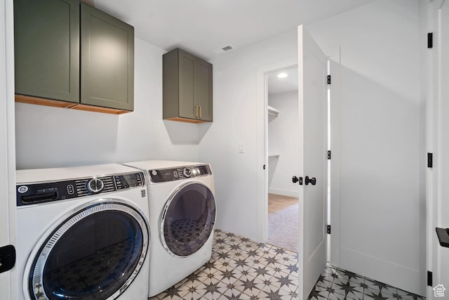 3317 S Watchman Trl, Moab, UT 84532 - washroom with cabinet space, washer and clothes dryer, and light floors