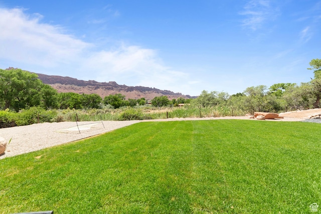 3317 S Watchman Trl, Moab, UT 84532 - view of grassy yard with a mountain view