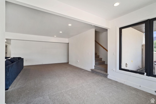 3317 S Watchman Trl, Moab, UT 84532 - unfurnished living room featuring carpet floors, recessed lighting, and stairway