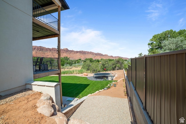 3317 S Watchman Trl, Moab, UT 84532 - view of yard featuring a balcony and a mountain view