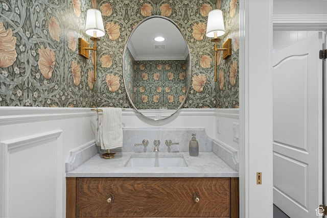 5040 S 1450 E, Ogden, UT 84403 - bathroom featuring wallpapered walls, vanity, crown molding, and wainscoting