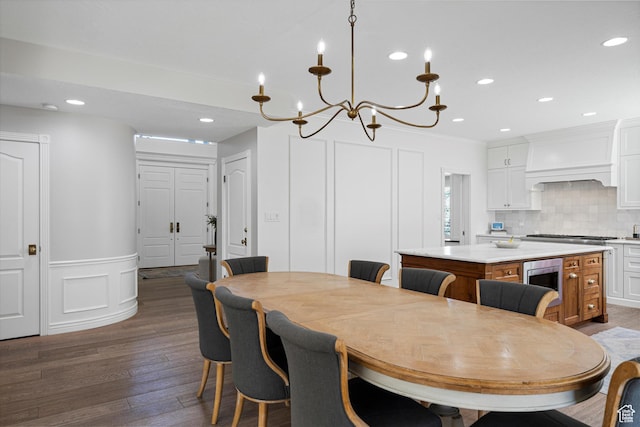 5040 S 1450 E, Ogden, UT 84403 - dining space with a decorative wall, dark wood-style flooring, a chandelier, recessed lighting, and a wainscoted wall