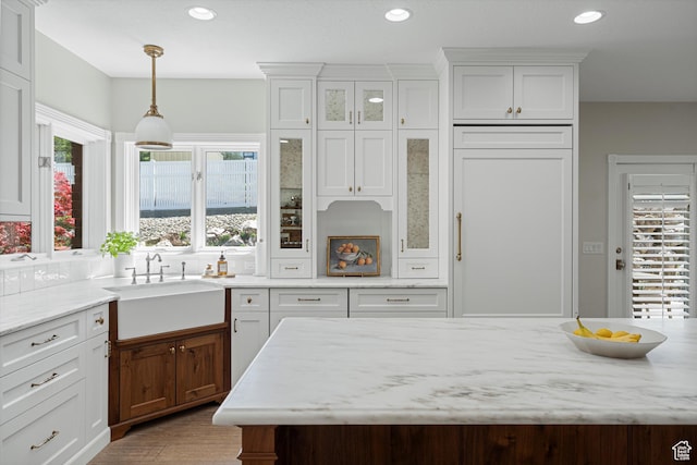 5040 S 1450 E, Ogden, UT 84403 - kitchen featuring healthy amount of natural light, white cabinetry, pendant lighting, recessed lighting, and glass insert cabinets