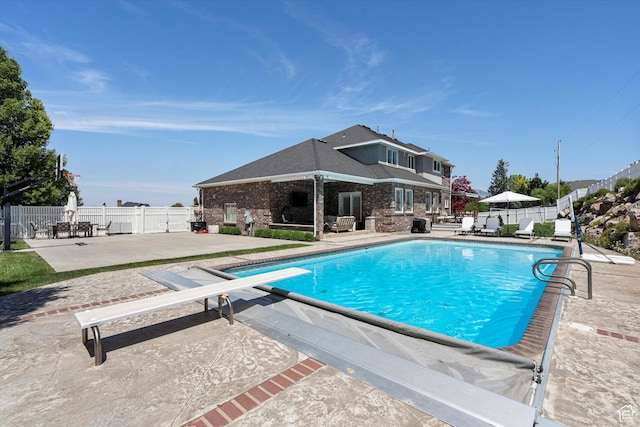 5040 S 1450 E, Ogden, UT 84403 - view of swimming pool with a patio and a diving board