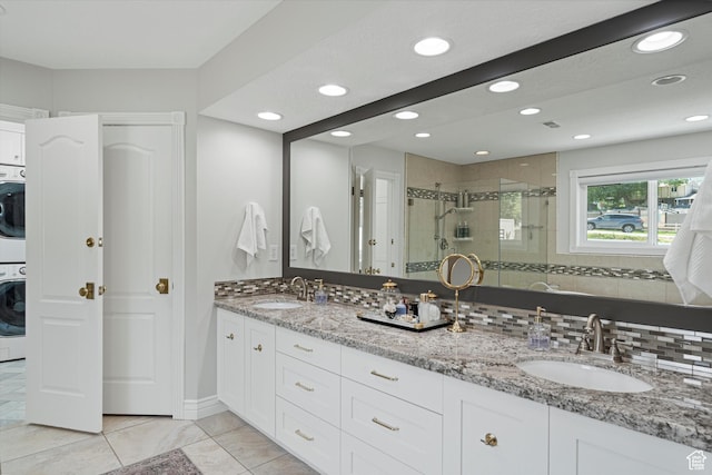 5040 S 1450 E, Ogden, UT 84403 - bathroom with stacked washing machine and dryer, a shower stall, double vanity, recessed lighting, and tile patterned flooring
