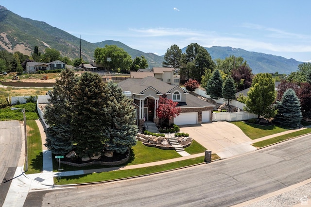 5040 S 1450 E, Ogden, UT 84403 - view of property hidden behind natural elements featuring driveway, a mountain view, and a garage