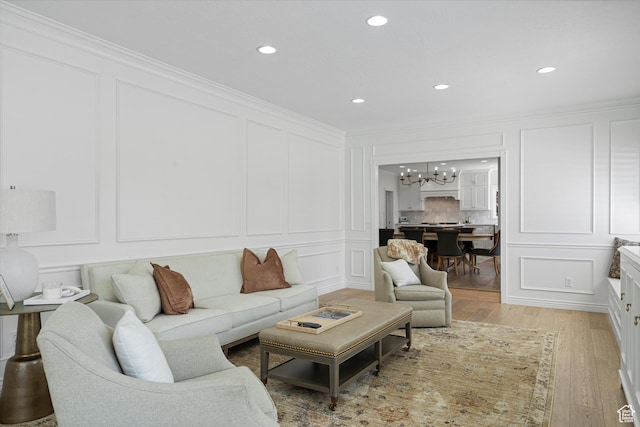 5040 S 1450 E, Ogden, UT 84403 - living room with a decorative wall, a chandelier, light wood finished floors, ornamental molding, and recessed lighting