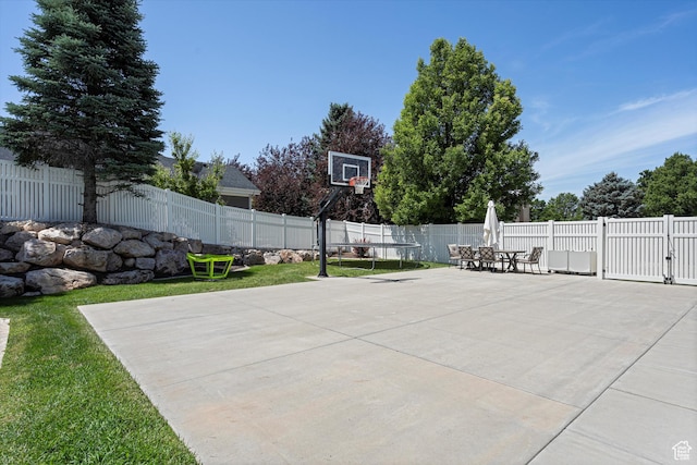 5040 S 1450 E, Ogden, UT 84403 - fenced backyard with basketball hoop, a patio area, and outdoor dining space