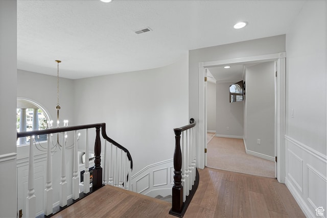 5040 S 1450 E, Ogden, UT 84403 - hall with a chandelier, wood finished floors, an upstairs landing, and recessed lighting