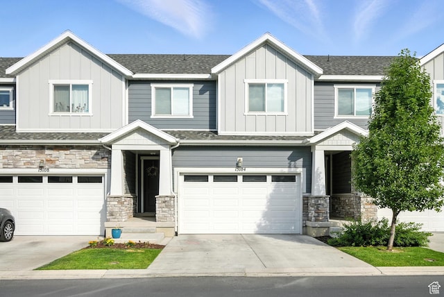 15104 S Halter Way, Bluffdale, UT 84065 - view of front facade with board and batten siding, stone siding, a garage, and driveway