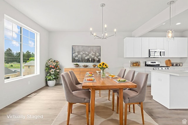 688 E 500 S Unit 108, Provo, UT 84606 - dining area featuring a chandelier and light wood-style flooring